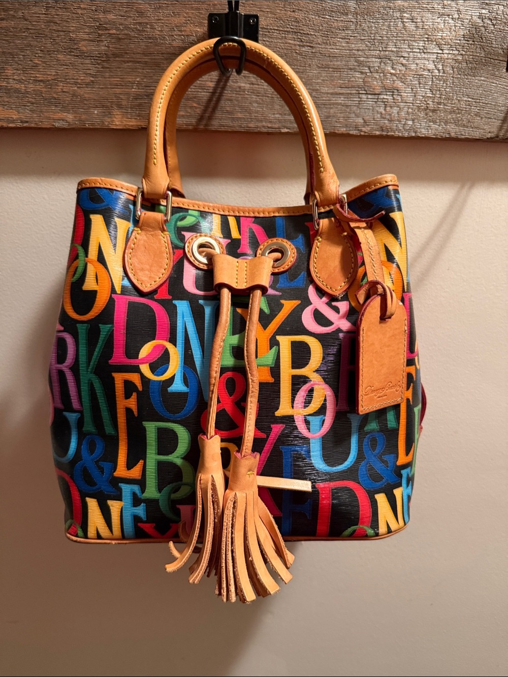 Dooney & Bourke Multicolor Letter-Print Drawstring Satchel with Tan Leather Trim